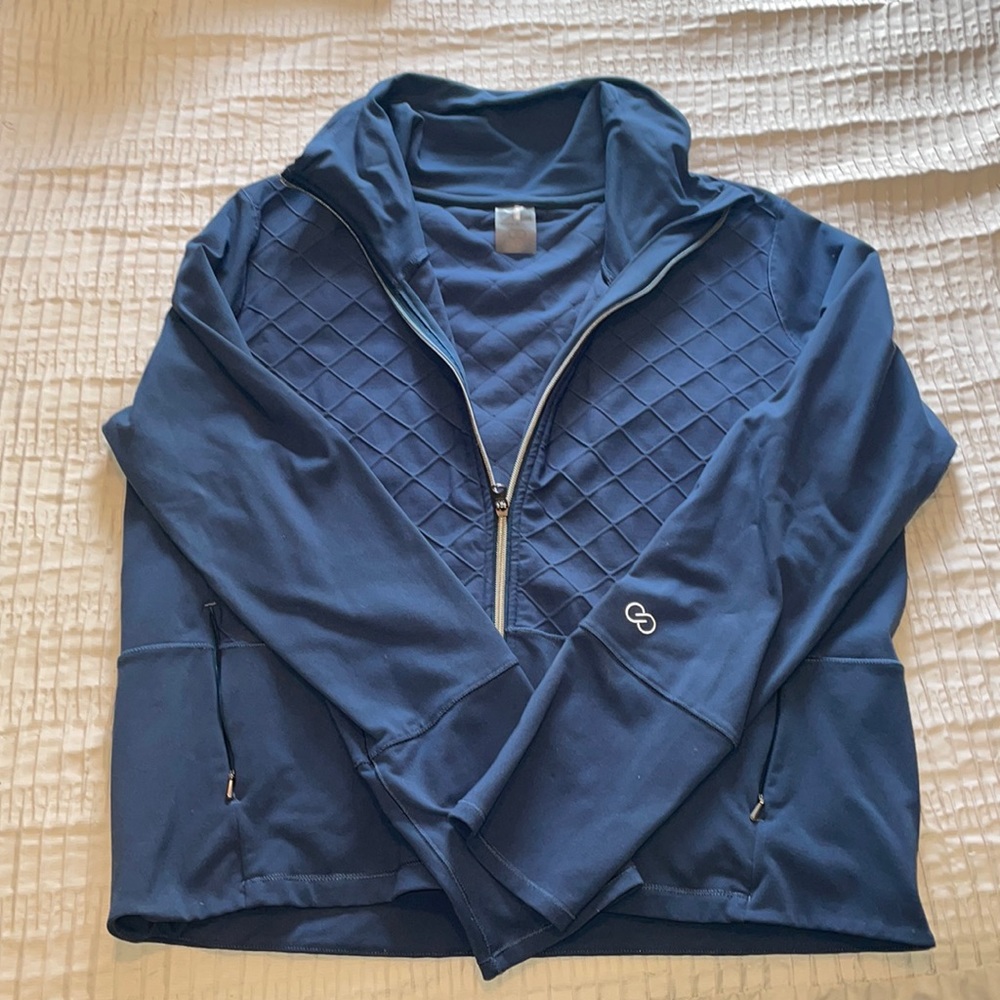 Blue athletic style jacket.